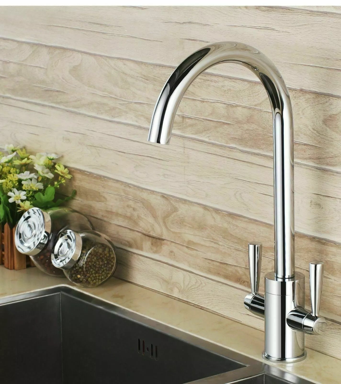 Modern chrome kitchen mixer tap with twin levers