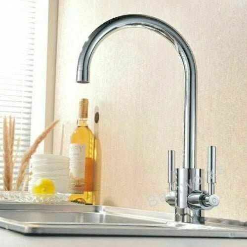 Modern chrome kitchen mixer tap with twin levers